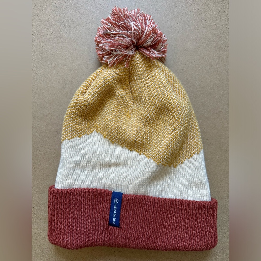 United By Blue - recycled chevron pom beanie in dandelion colorway - sustainable